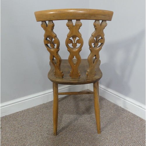 356 - A set of four vintage ash kitchen chairs, all with carved backs, one chair has a different shaped se... 