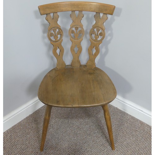 356 - A set of four vintage ash kitchen chairs, all with carved backs, one chair has a different shaped se... 