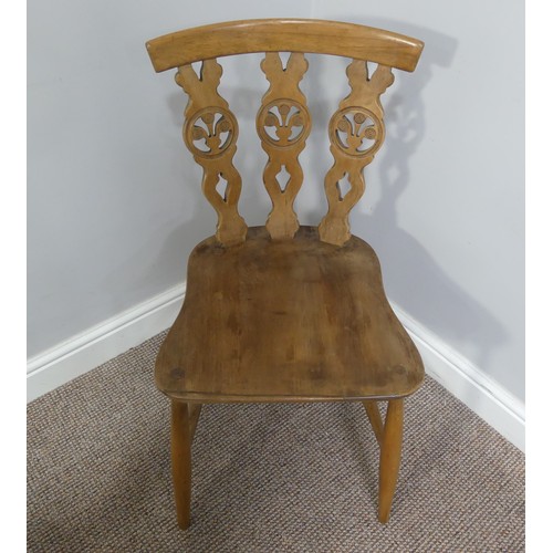 356 - A set of four vintage ash kitchen chairs, all with carved backs, one chair has a different shaped se... 