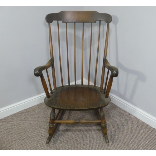 357 - A vintage stick back rocking chair, W 63cm x H 102cm x D 74cm.