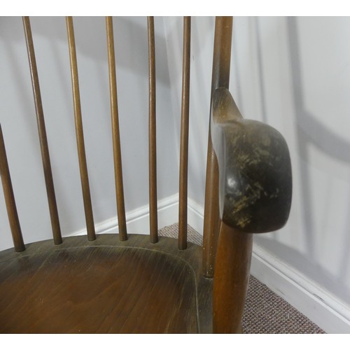 357 - A vintage stick back rocking chair, W 63cm x H 102cm x D 74cm.