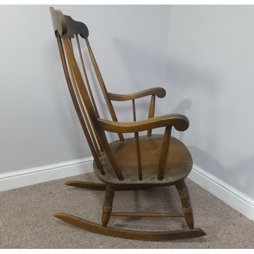 357 - A vintage stick back rocking chair, W 63cm x H 102cm x D 74cm.