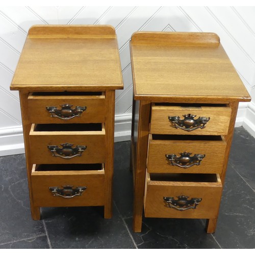 391 - A pair of Arts & Crafts light oak three-drawer Bedside Cabinets, fitted with later embossed bras... 