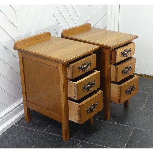 391 - A pair of Arts & Crafts light oak three-drawer Bedside Cabinets, fitted with later embossed bras... 