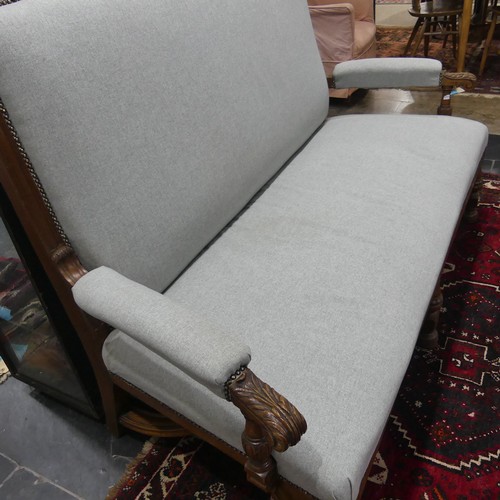 394 - An early 20thC oak framed upholstered Settle, W 159cm x H 124cm x D 76cm.... 