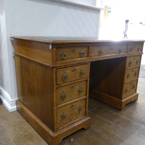 395 - An early 20thC Gothic style oak Pedestal Desk, the rectangular top with tooled leather writing inset... 