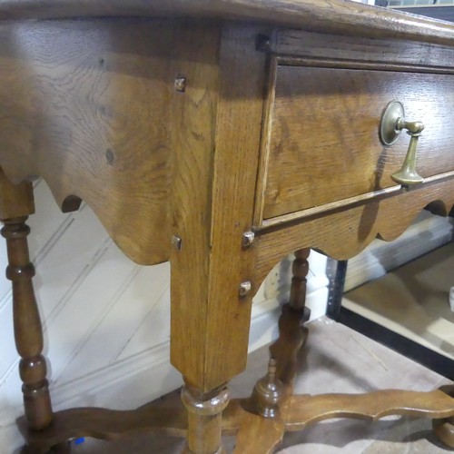 397 - A Queen Anne style oak Side Table, the rectangular top over a singular frieze drawer with tear drop ... 