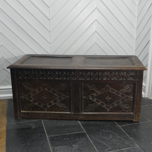 403 - An 18th century oak two-panel Coffer, with carved decoration on front and side panels, W 118cm x H 4... 