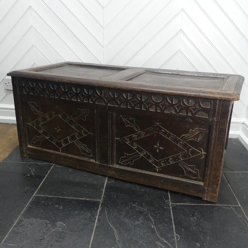 403 - An 18th century oak two-panel Coffer, with carved decoration on front and side panels, W 118cm x H 4... 