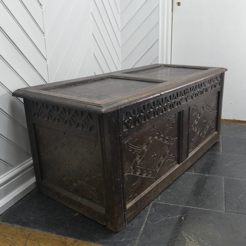 403 - An 18th century oak two-panel Coffer, with carved decoration on front and side panels, W 118cm x H 4... 