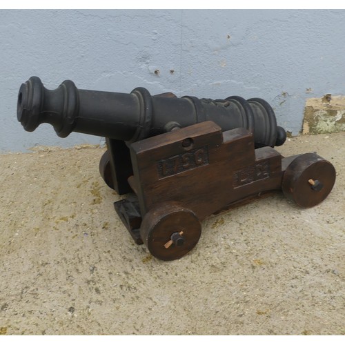 405 - A decorative Floor standing Cannon, W 40cm x H 43cm x D 74cm.