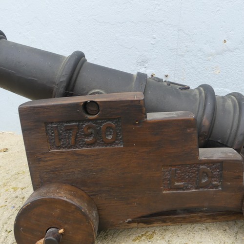 405 - A decorative Floor standing Cannon, W 40cm x H 43cm x D 74cm.