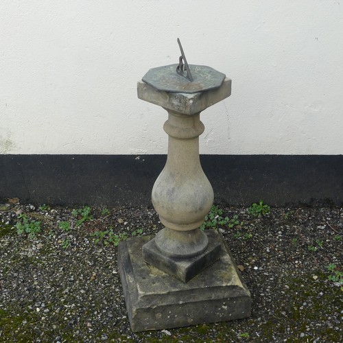 499 - Garden Statuary; a reconstituted stone baluster with associated decorative metal sundial, W 32cm x H... 