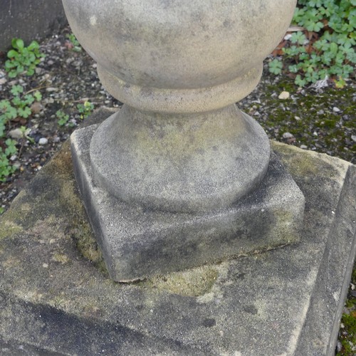 499 - Garden Statuary; a reconstituted stone baluster with associated decorative metal sundial, W 32cm x H... 