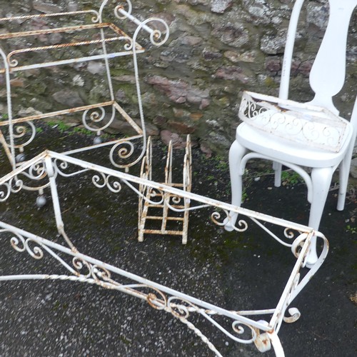 500 - Garden; a white scrollwork metal coffee table frame, lacks top, together with a trolley, rack and sh... 