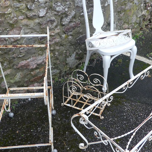 500 - Garden; a white scrollwork metal coffee table frame, lacks top, together with a trolley, rack and sh... 