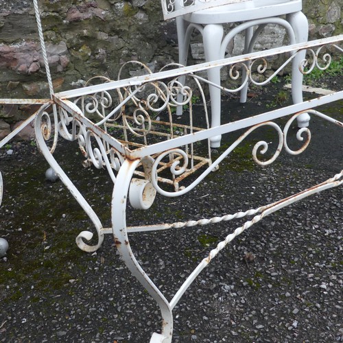 500 - Garden; a white scrollwork metal coffee table frame, lacks top, together with a trolley, rack and sh... 