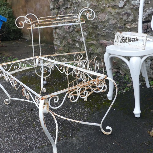 500 - Garden; a white scrollwork metal coffee table frame, lacks top, together with a trolley, rack and sh... 