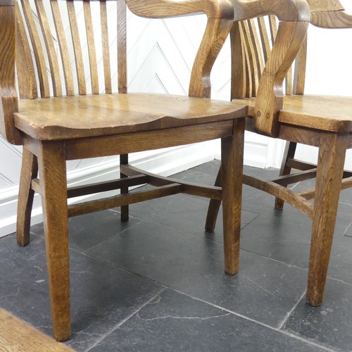 419 - A pair of early 20thC oak Desk Chairs, each W 59cm x H 82cm x D 57cm (2)