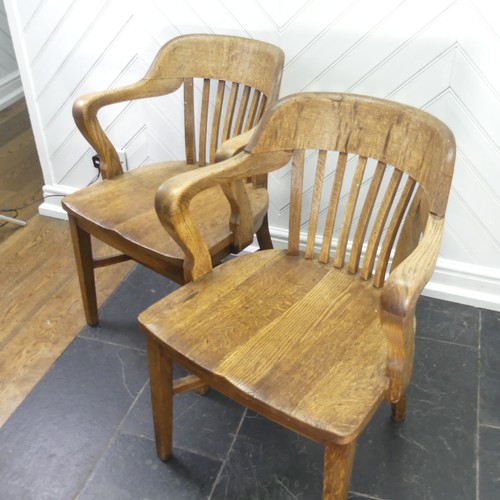 419 - A pair of early 20thC oak Desk Chairs, each W 59cm x H 82cm x D 57cm (2)