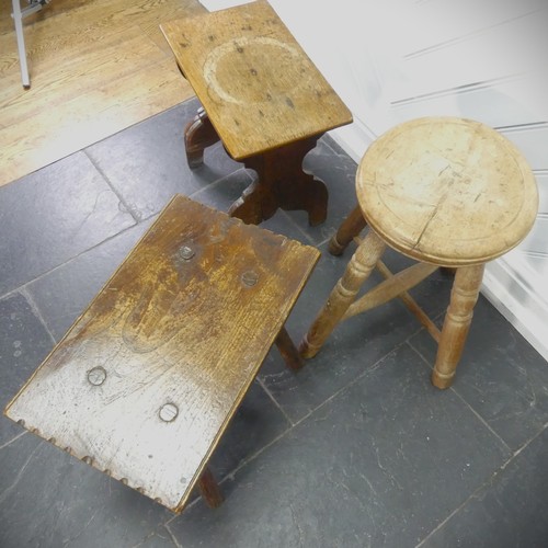 435 - An antique rustic Milking Stool, the rectangular top raised on four round legs supported by two stre... 