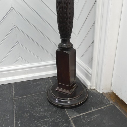 436 - A Victorian carved mahogany torchere, with a screw on circular top mounted on a reeded column and we... 