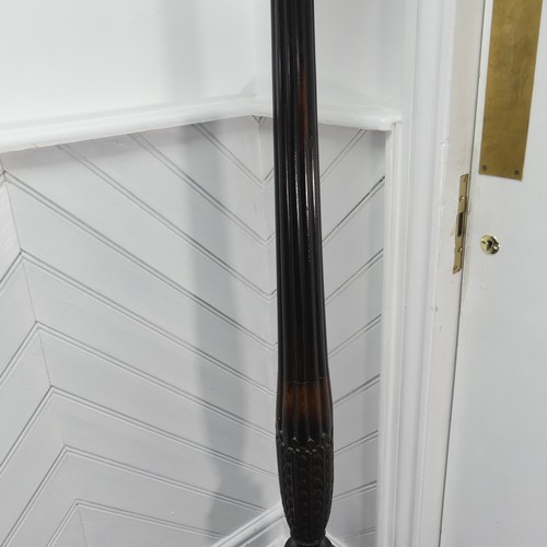 436 - A Victorian carved mahogany torchere, with a screw on circular top mounted on a reeded column and we... 