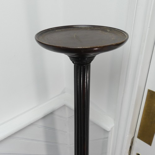 436 - A Victorian carved mahogany torchere, with a screw on circular top mounted on a reeded column and we... 