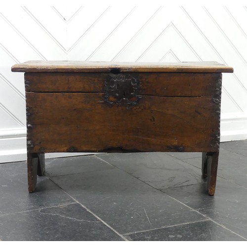 438 - An antique oak Coffer, of small size raised on stile feet, the interior with candlebox, with alterat... 