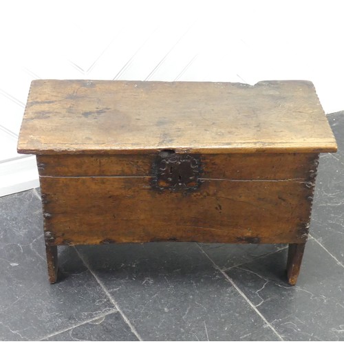 438 - An antique oak Coffer, of small size raised on stile feet, the interior with candlebox, with alterat... 