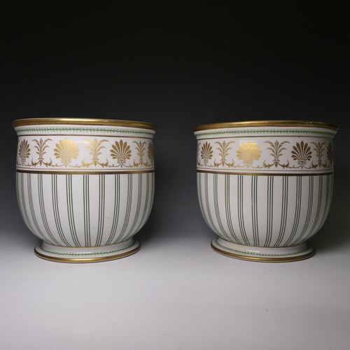 79 - A pair of 20thC Continental porcelain Jardinieres, painted with green decorations and gilt banding, ... 