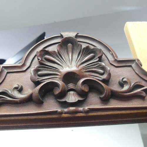 443 - A decorative wall mirror with carved hardwood frame (formally a fire screen), W 64cm x H 96cm.... 