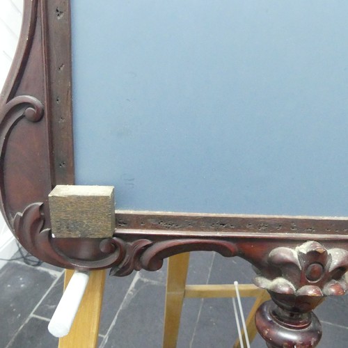 443 - A decorative wall mirror with carved hardwood frame (formally a fire screen), W 64cm x H 96cm.... 