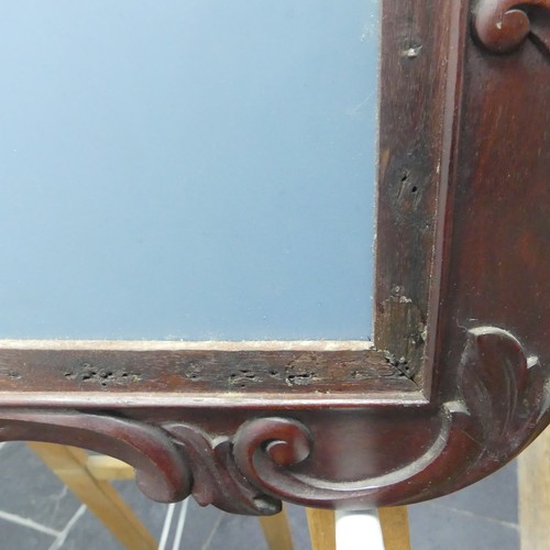 443 - A decorative wall mirror with carved hardwood frame (formally a fire screen), W 64cm x H 96cm.... 