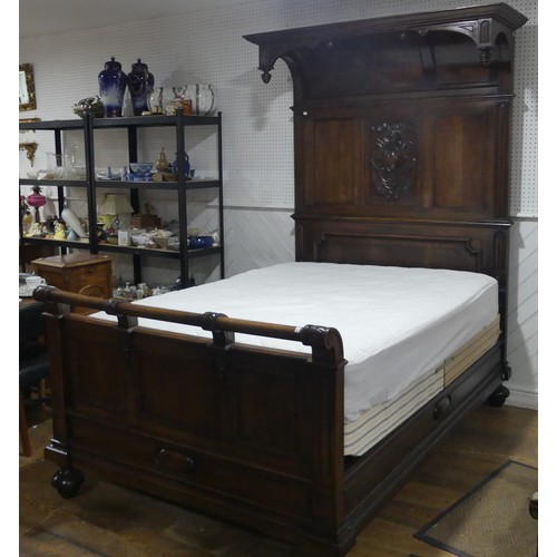 446 - A early 20thC walnut complete Half Tester Bed, with carved panelled headboard and base board, Headbo... 