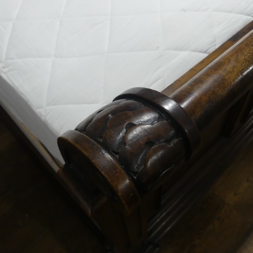 446 - A early 20thC walnut complete Half Tester Bed, with carved panelled headboard and base board, Headbo... 