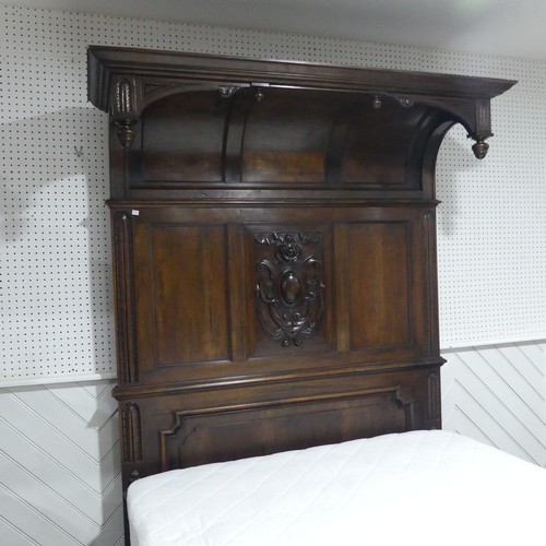 446 - A early 20thC walnut complete Half Tester Bed, with carved panelled headboard and base board, Headbo... 