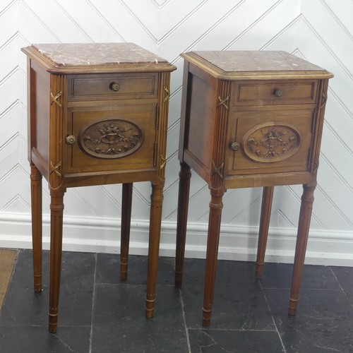 447 - A pair of Louis XVI style kingwood Pot Cupboards, with marble tops and single frieze drawers above c... 