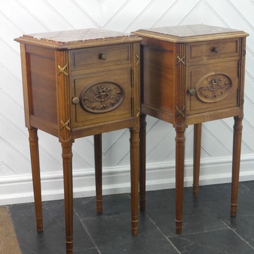 447 - A pair of Louis XVI style kingwood Pot Cupboards, with marble tops and single frieze drawers above c... 