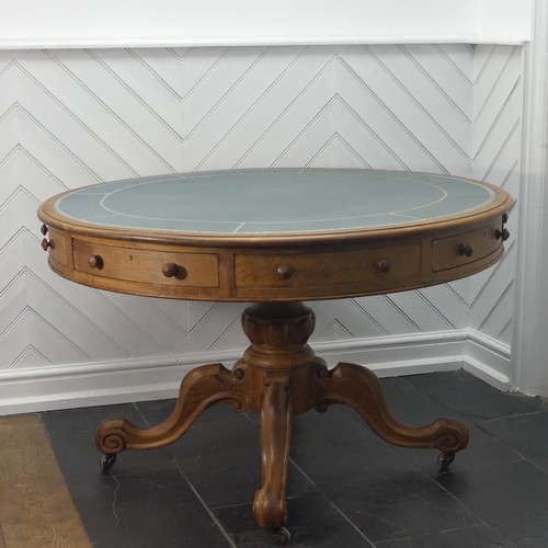 450 - A early 20thC Victorian oak Drum Table, the circular top with a tooled leather writing surface over ... 