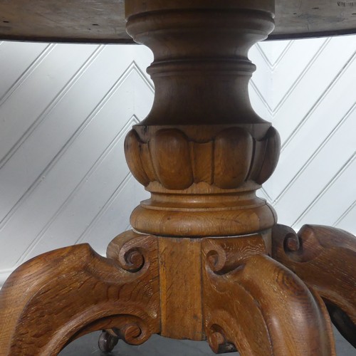 450 - A early 20thC Victorian oak Drum Table, the circular top with a tooled leather writing surface over ... 