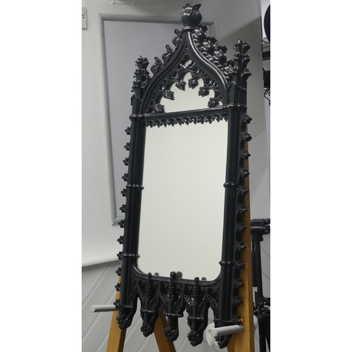 455 - A decorative Wall Mirror with black Gothic style frame, W 42cm x H 88cm.