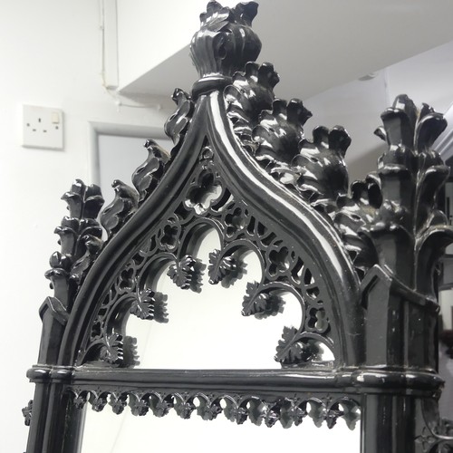 455 - A decorative Wall Mirror with black Gothic style frame, W 42cm x H 88cm.