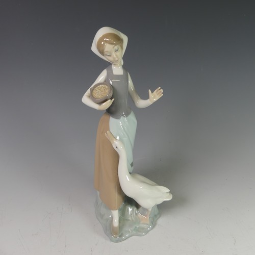 106 - A small quantity of Lladro Figures, to comprise Goose Girl, Young Girl Carrying Basket, Seated Clown... 