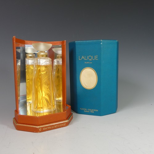 A Lalique 'Les Muses' glass Scent Bottle, from the Flacon Collection, 1994, 60ml, numbered D0106 on the side and 'Lalique France' to base, on edge bearing signature 'MCLalique', 13cm high, in original presentation box.