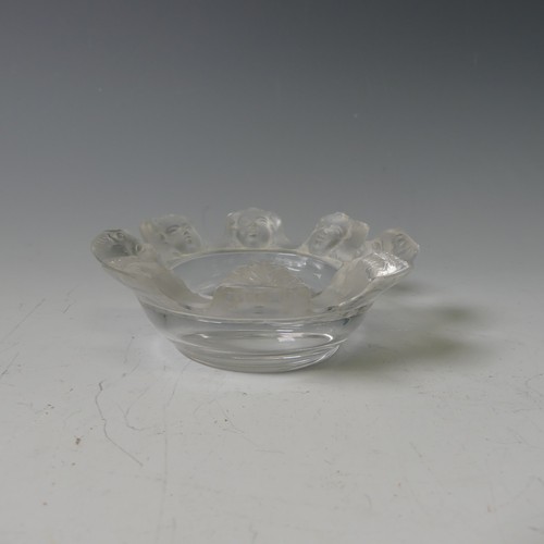 122 - A Lalique glass Ashtray, modelled with eight faces between cigarette rests, with etched signature to... 