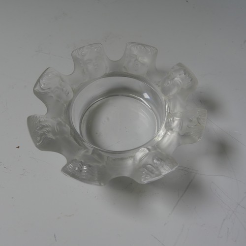 122 - A Lalique glass Ashtray, modelled with eight faces between cigarette rests, with etched signature to... 