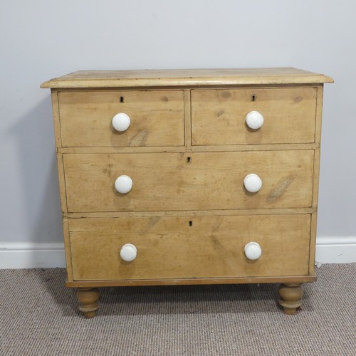 363 - A pine Chest of Drawers, comprising two short over two long drawers, raised on turned feet, W 86cm x... 