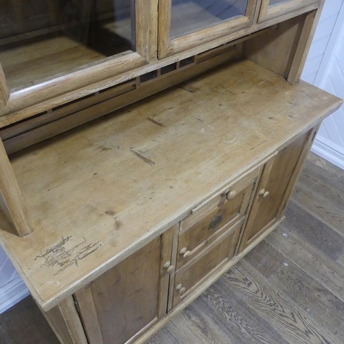 371 - An Early 20thC glazed pine Dresser, with ceramic spice draws, W 137cm x H 173cm x D 55.5cm.... 