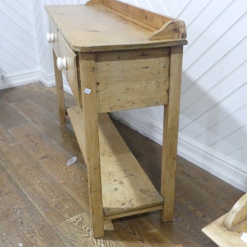 375 - An early 20thC pine Dresser Base, with two draws, W 137.5cm x H 92cm x D 42cm.